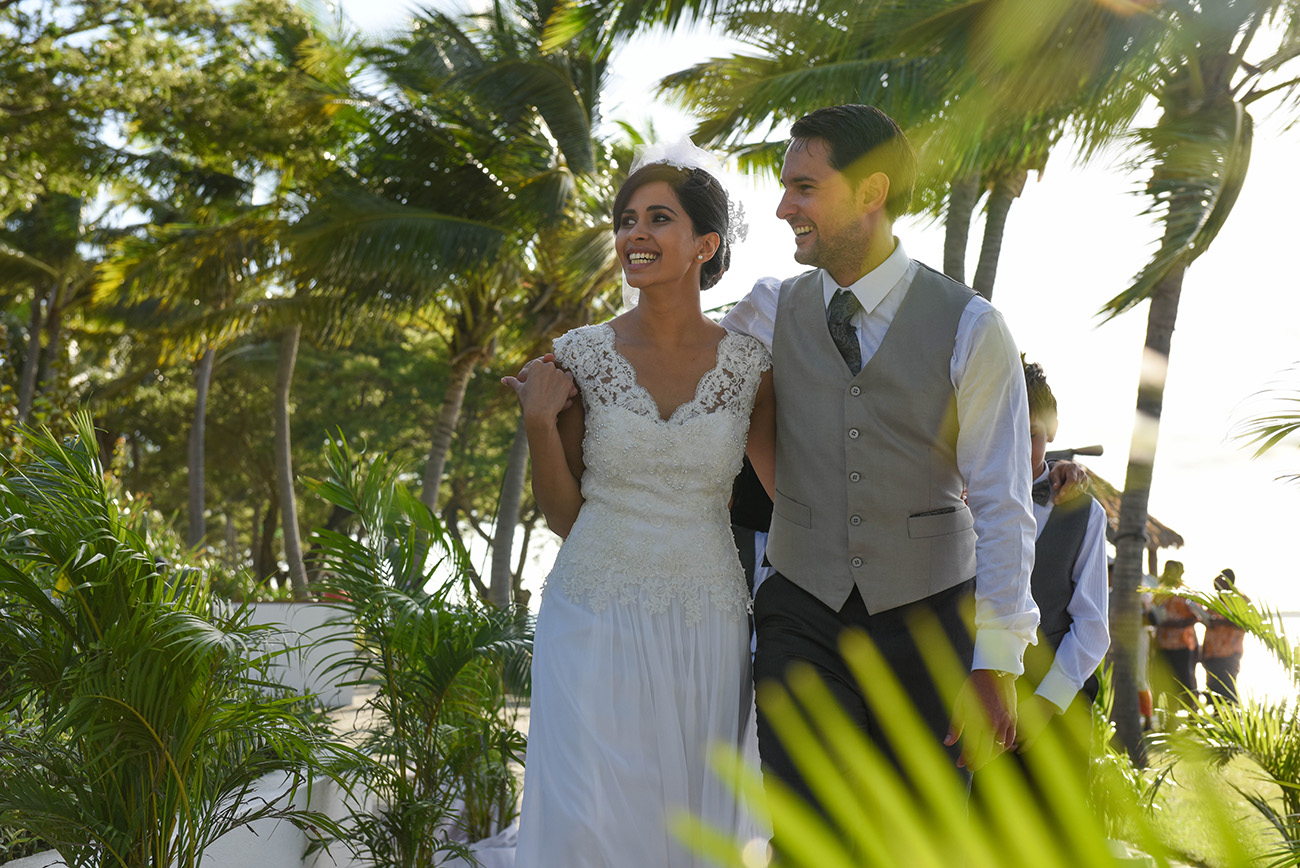 In a beautiful scenery in Fiji the bride and groom laughing together