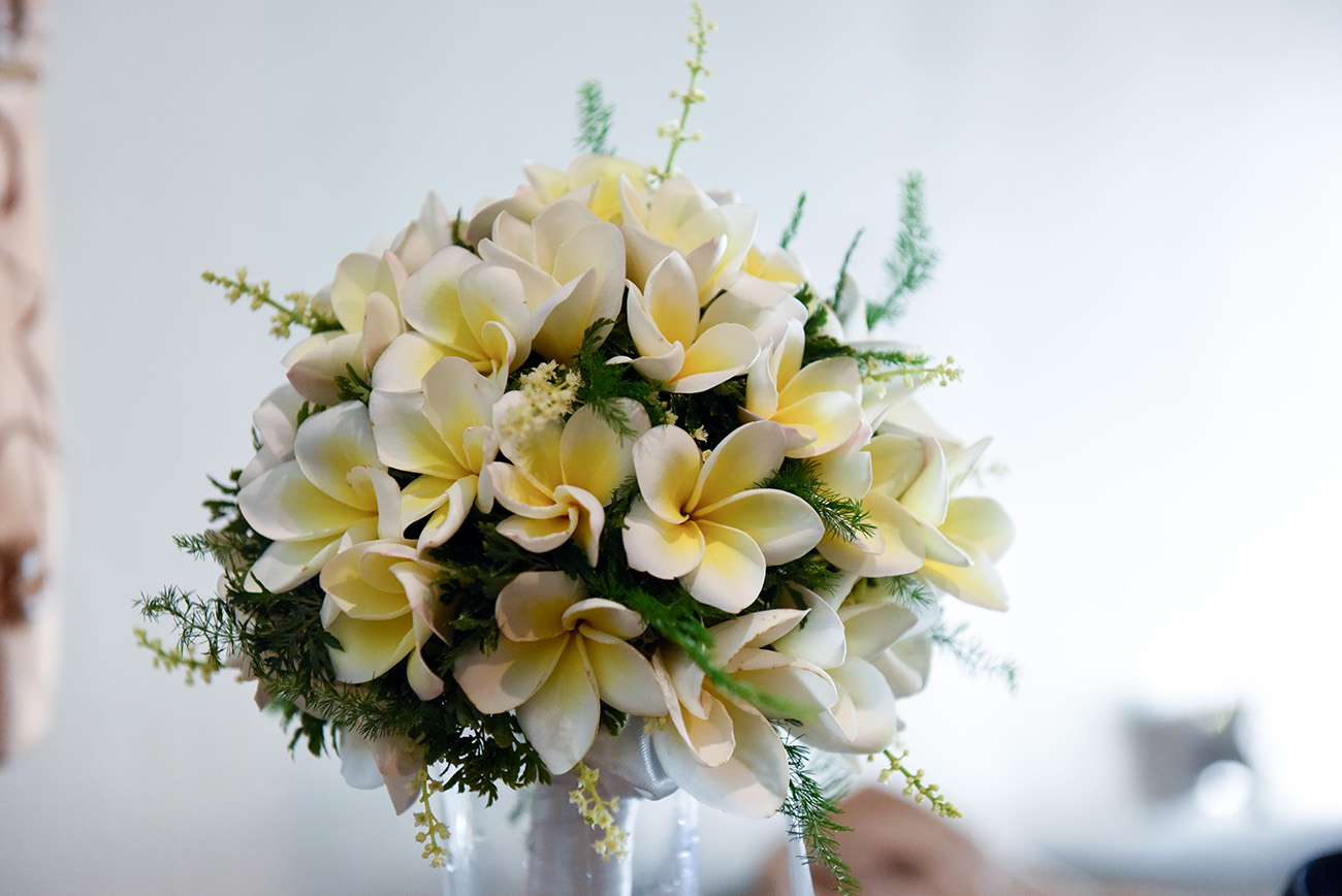The frangipani bouquet with local tropical flower for the bride At Paradise Cove Island resort in the Yasawas, Fiji