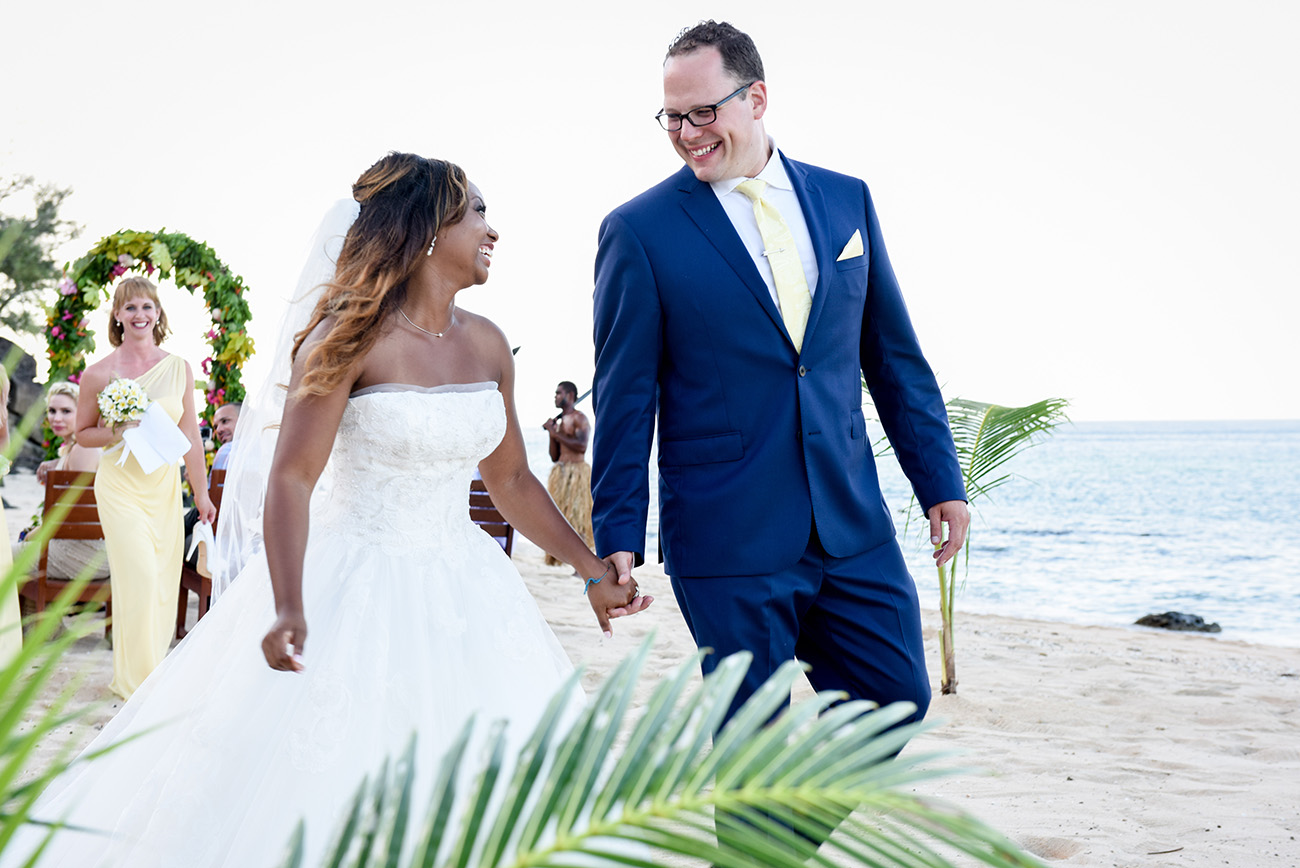 Husband and wife : just married are walking out the ceremony At Paradise Cove Island resort in the Yasawas, Fiji
