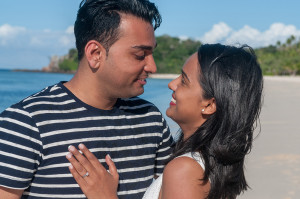 Couple looking into each others eyes smiling with love at Mana Island resort, Fiji by Anais Photography