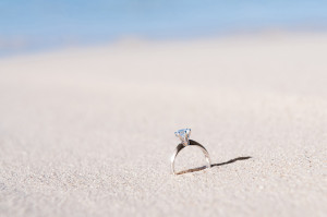 Engagement ring with a big diamond on the white sand at Mana Island resort, Fiji by Anais Photography