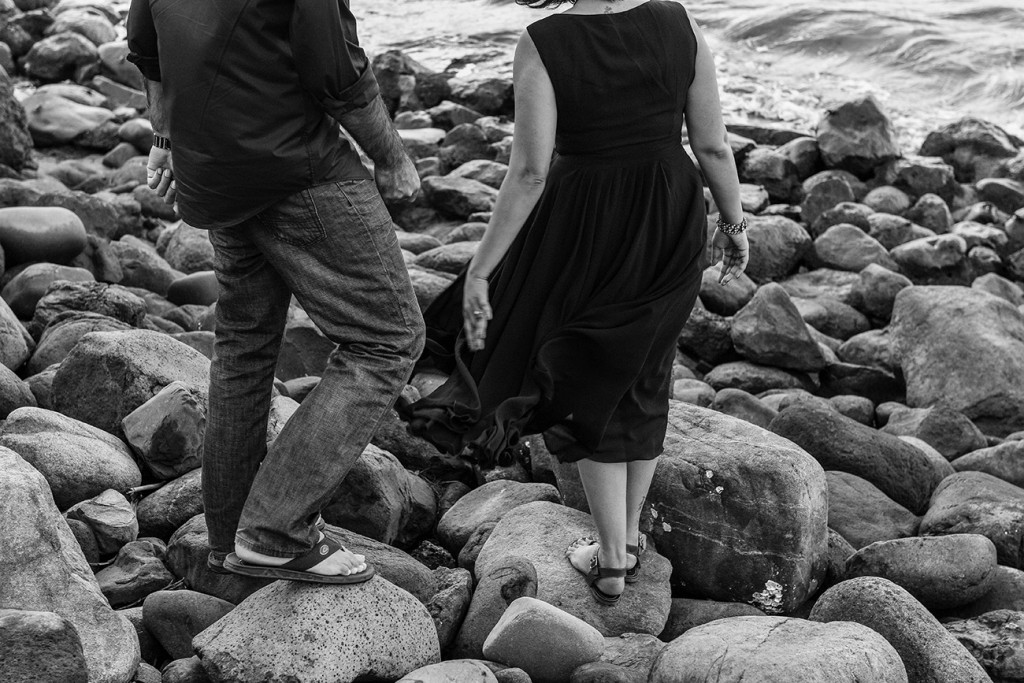 Couple walking on the rockas by the sea at the Westin Resort in Denerau Fiji