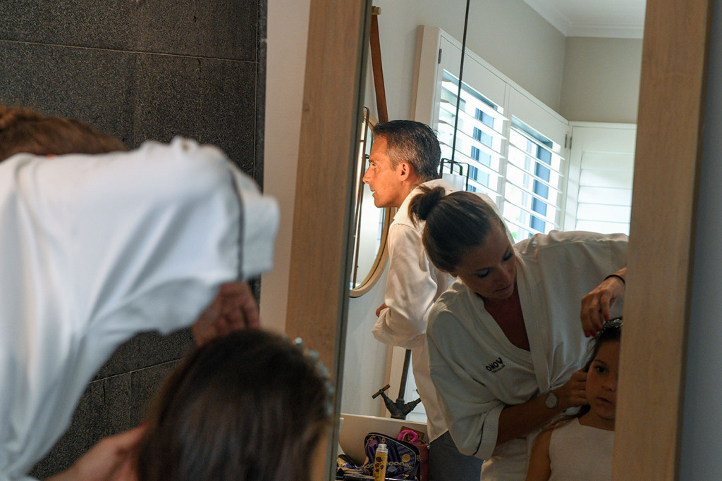 Busy bathroom while the family is getting ready for the renewal of vows at Vomo Island resort, Fiji