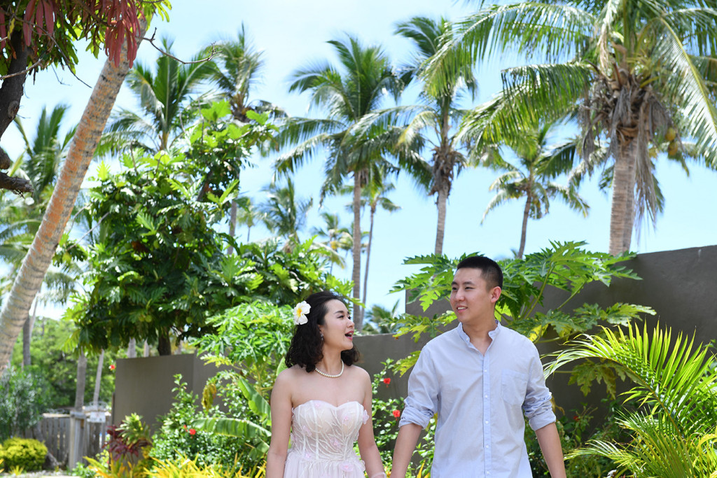 brode and groom walking to the ceremony at Paradise Cove island resort, Fiji