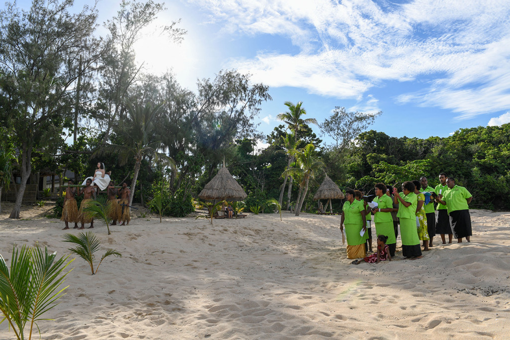 The Fijian traditional choir is singing while the bride is entering the ceremony at Paradise cove island resort, Yasawas, Fiji
