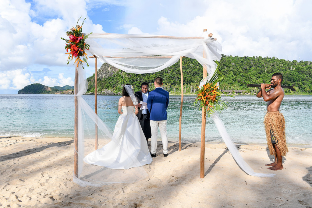 Four poles are used with flowers as an arch for the wedding ceremony at Paradise cove island resort, Yasawas, Fiji