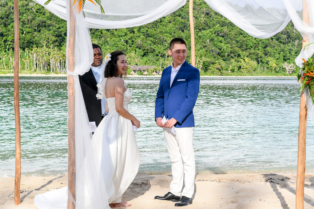 Bride and groom are waiting for their rings at Paradise cove island resort, Yasawas, Fiji