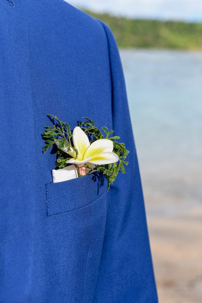 The groom's boutonniere made of greens and frangipane flower at Paradise cove island resort, Yasawas, Fiji