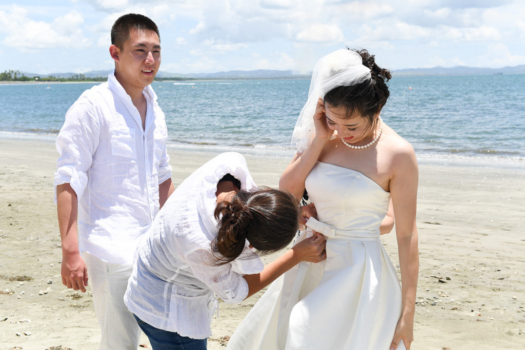 the bride is getting ready for photography by the sheraton beach in Denerau, Fiji