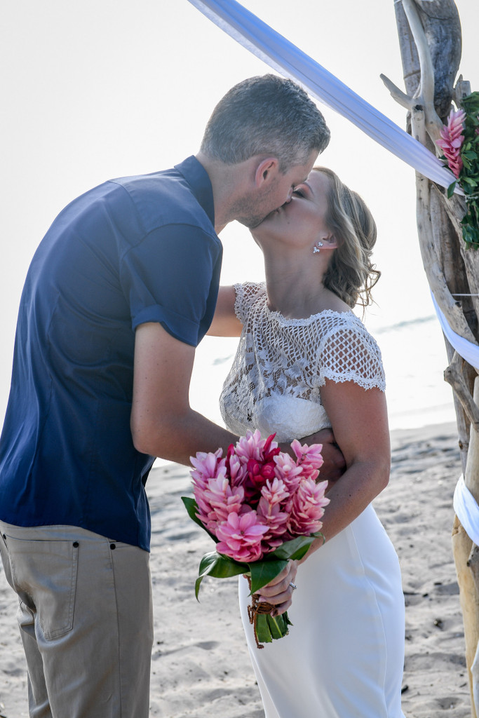 Bride and groom kiss on Yatule Fiji beach wedding