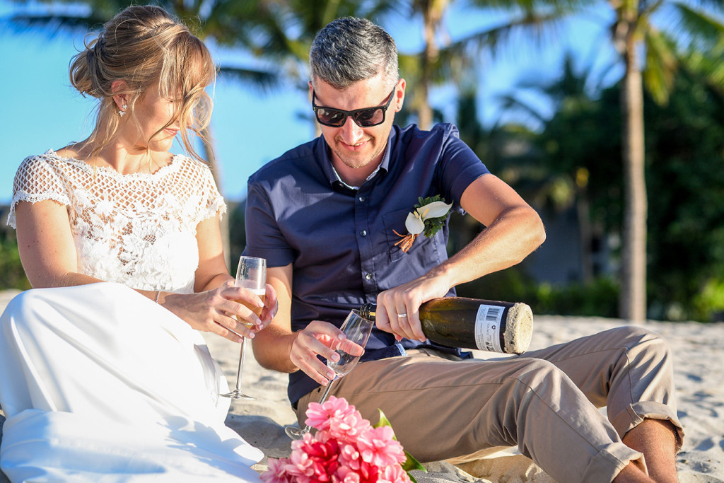 Married couple open the bubbly in Yatule Fiji Resort