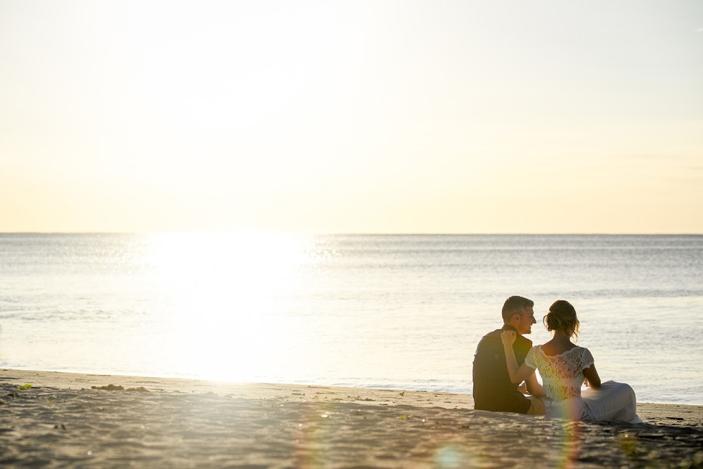 Eloped couple facing the sunset in Coral Coast Fiji