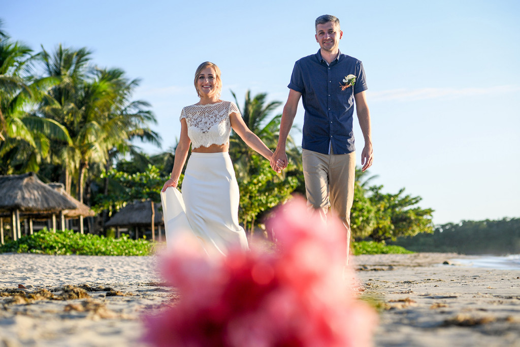 Eloped couple walk down the Coral Coast Fiji