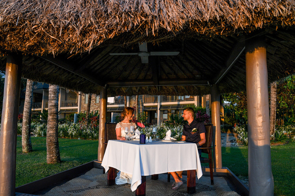 Eloped couple dinner in the sunset Yatule Fiji Resort
