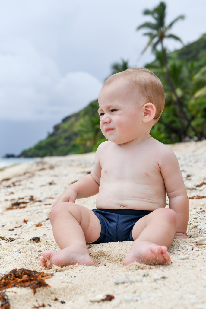 Baby seated on the shores of Vomo resort Fiji