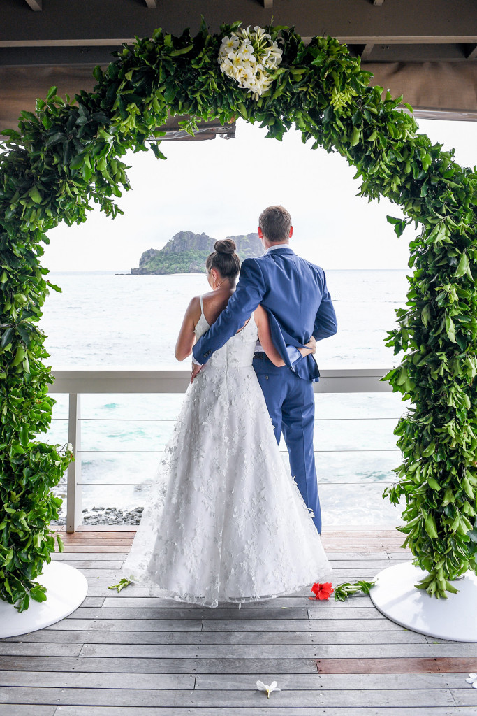 Couple stares into the sea at Vomo Island Resort Fiji