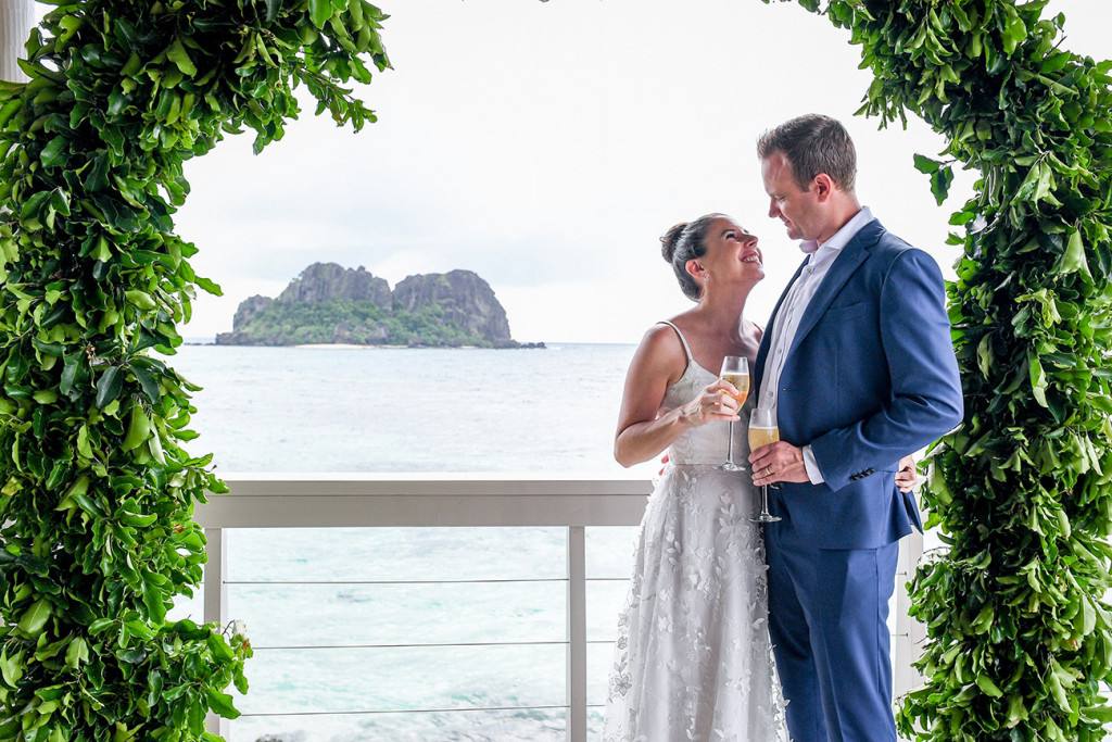 Loving couple overlooking pacific ocean at Vomo Island Resort Fiji