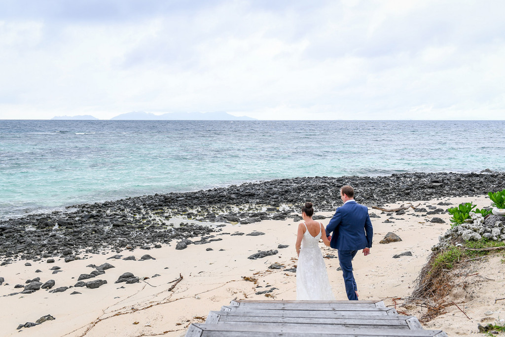 Couple's beach walk at Vomo Island Resort Fiji