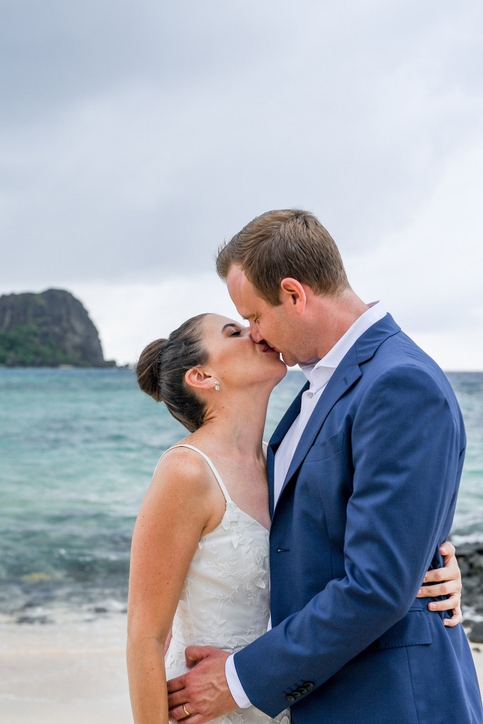 Couple's kiss by the sea at Vomo Island Resort Fiji