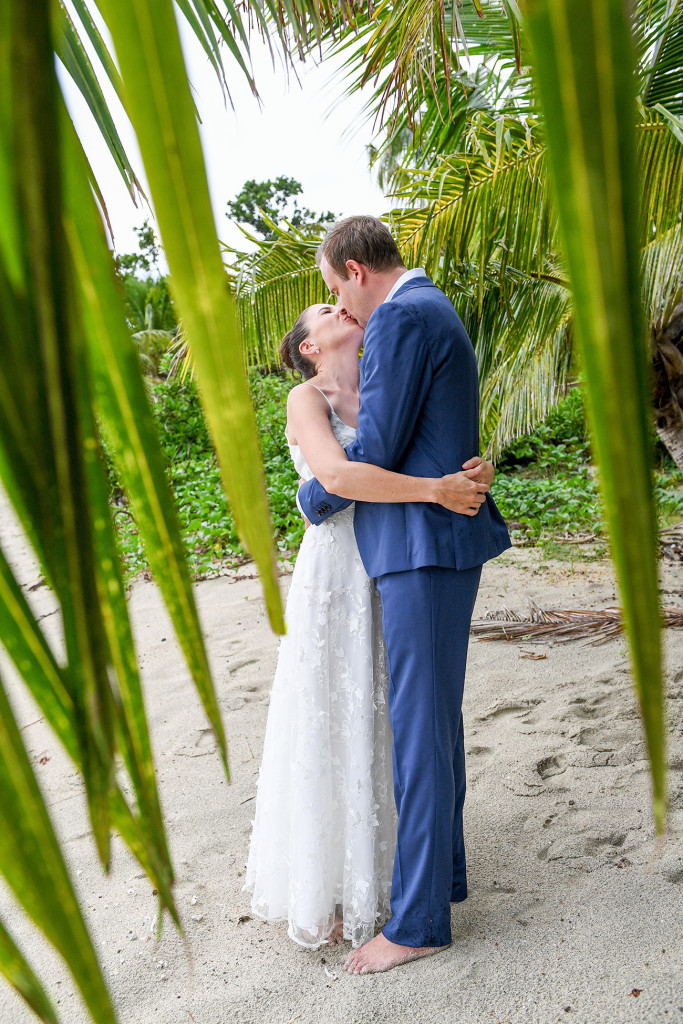 Loving kiss at Vomo Island Resort Fiji family wedding