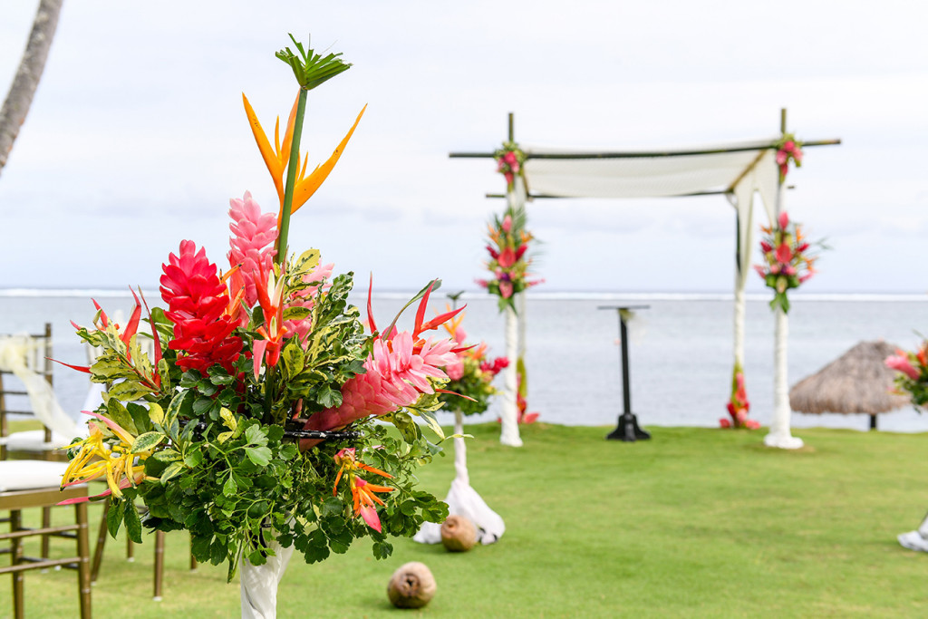 Floral pink detail of wedding bouqet beside gazebo at Warwick Fiji