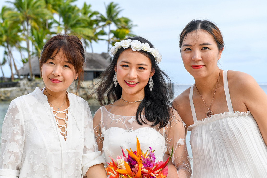 Stunning asian bride with friends on Warwick beach Fiji