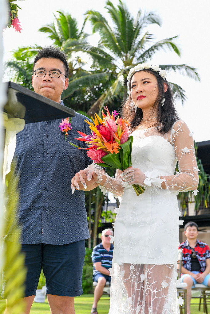Stunning asian couple married at Warwick beach Fiji at the altar