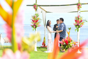 Asian couple marrying under gazebo in Fiji beach wedding Warwick