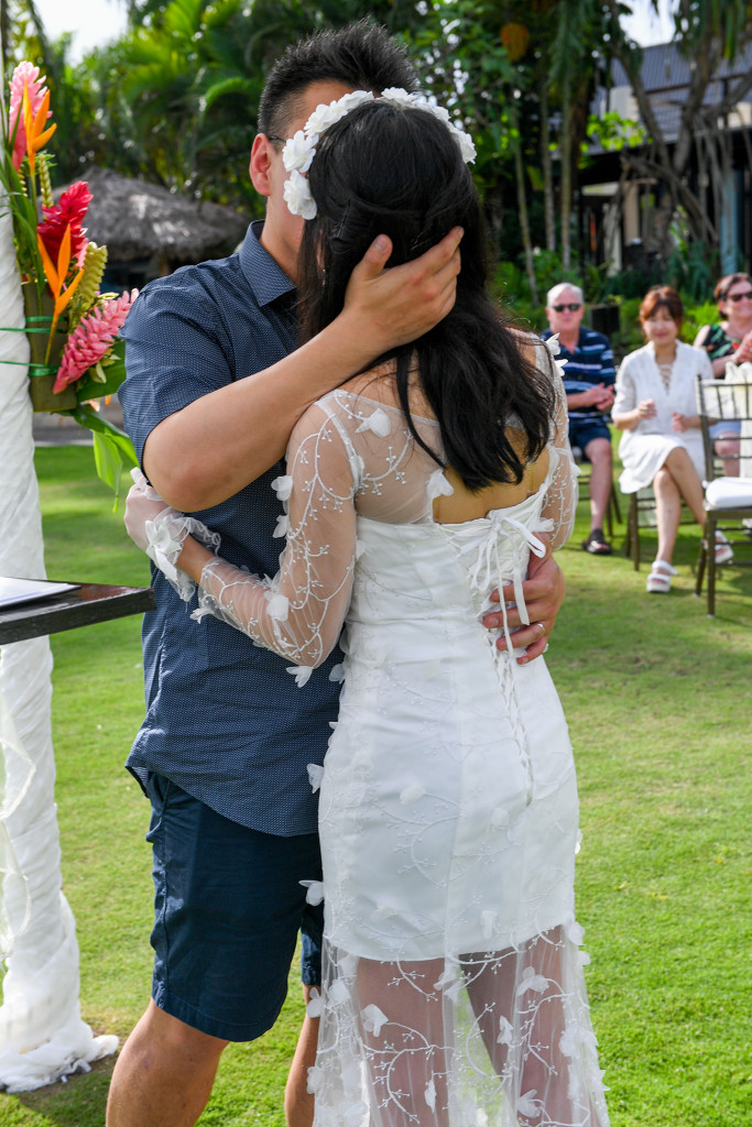 Asian bride and groom kiss at the beach in Warwick Fiji wedding