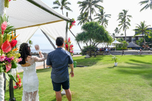 Bride and groom walk towards Warwick Fiji wedding