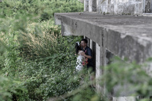 Married couple kiss under abandoned building in Warwick Fiji