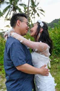 Bride and groom cuddle in wedding photography Fiji