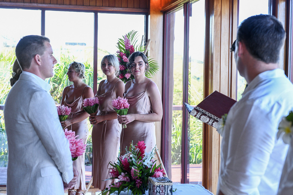 Bridesmaid watching celebrant in Outrigger wedding