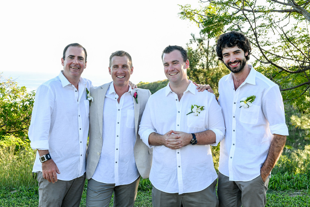Groomsmen smile at the camera in The Outrigger Fiji Wedding