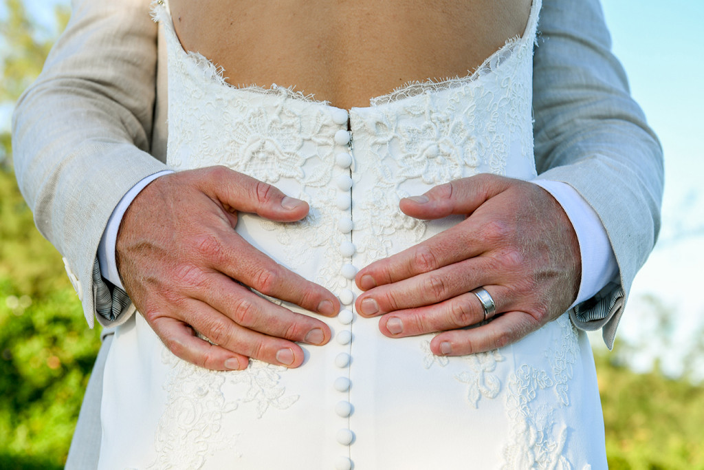 Groom's hands on bride's butt in Fiji wedding