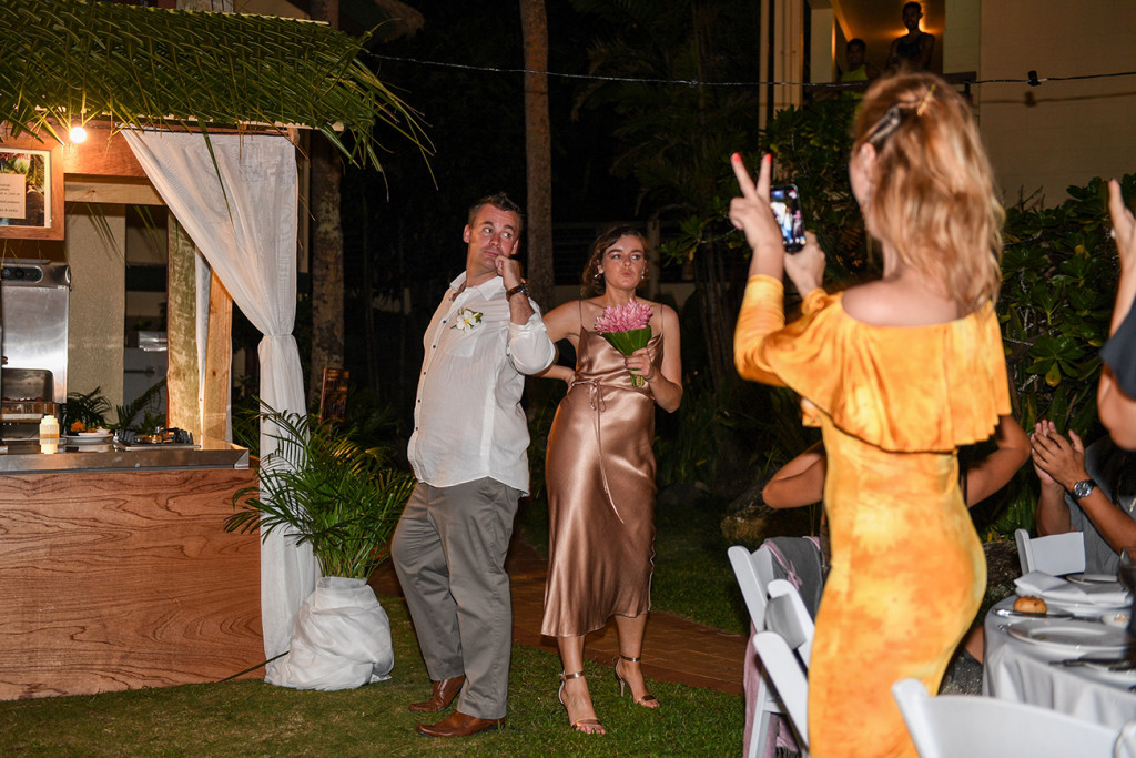 Bridesmaid & groomsman goof around & dance into the reception