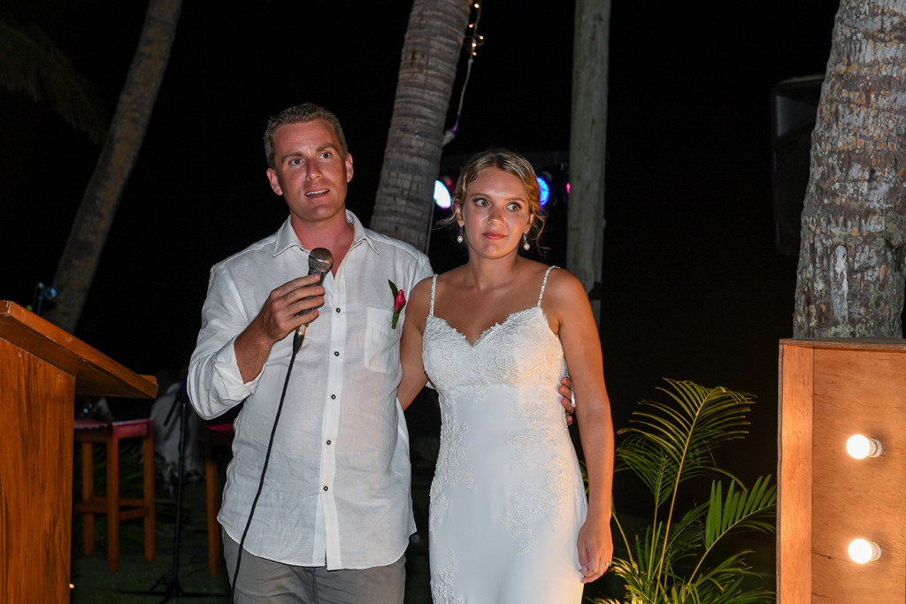 Groom gives speech while standing by his bride at the Outrigger beach resort