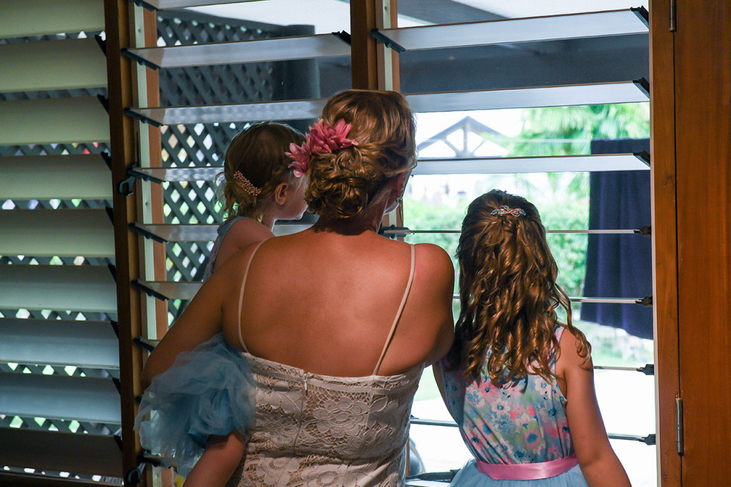 Bride carries daughter to ceremony in Plantation Island Resort
