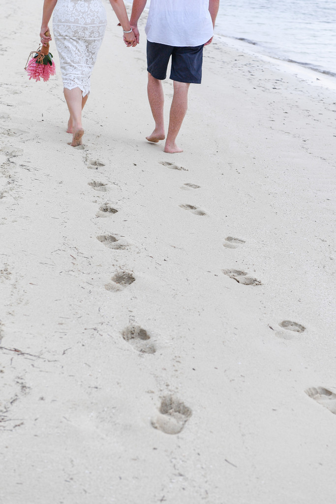 Footprints of newly married couple on the beach in Fiji Plantation Island Resort