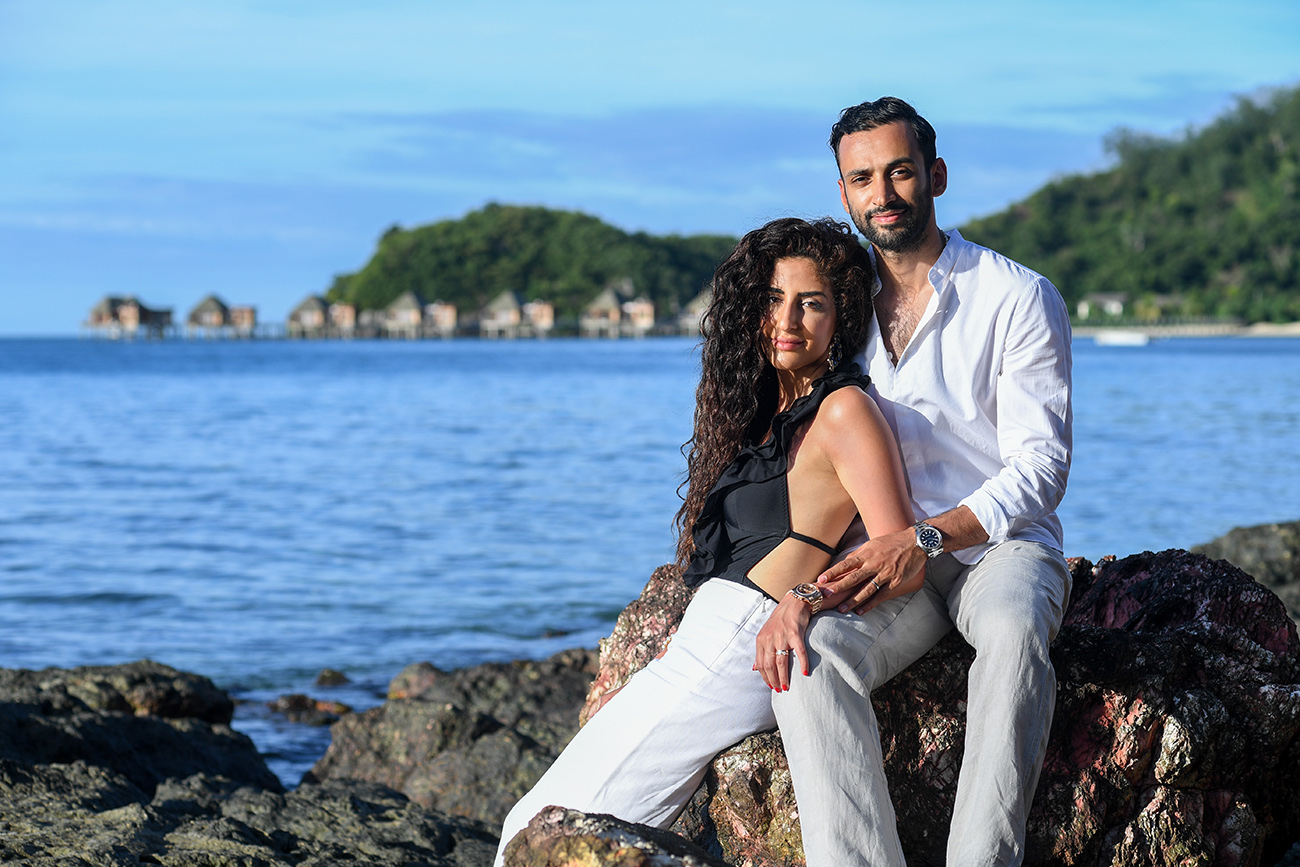 Newly wed couple stare into the camera in Likuliku Fiji Resort