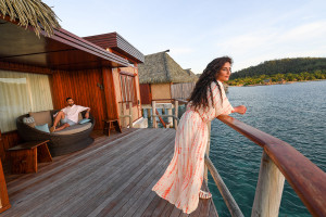 Bride looking at sea from cozy Villa at the ocean