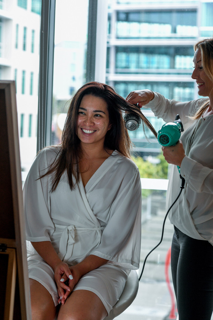 Bride's hair being straightened at the Sofitel Auckland