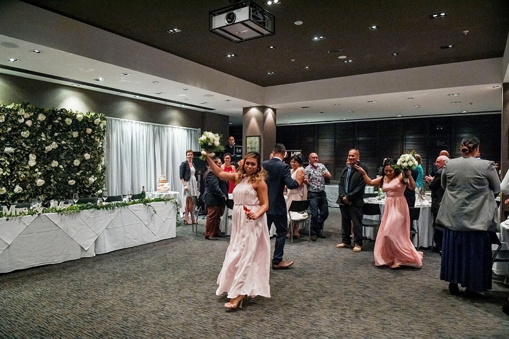 Bride and bridesmaids dance on the floor