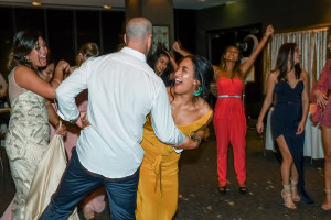 Wedding guests laugh and dance at the Wedding ceremony in Sofitel Auckland