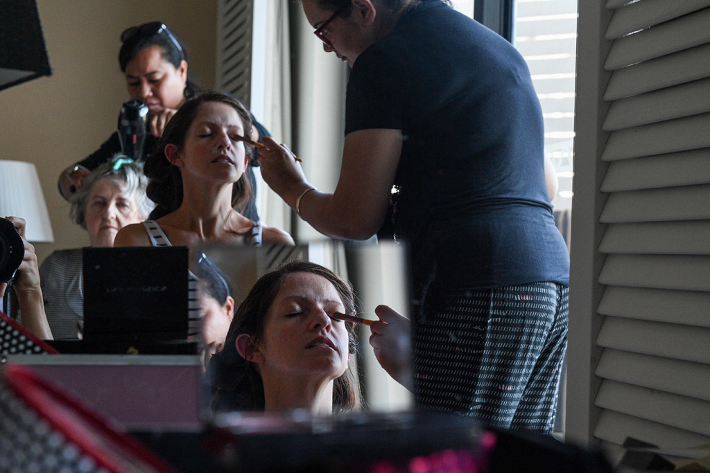Inception reflection photo of bride getting her makeup done