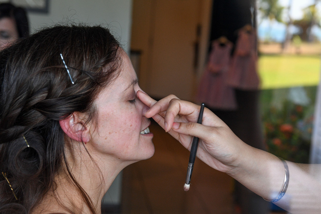 Eye shadow touch up on the bride
