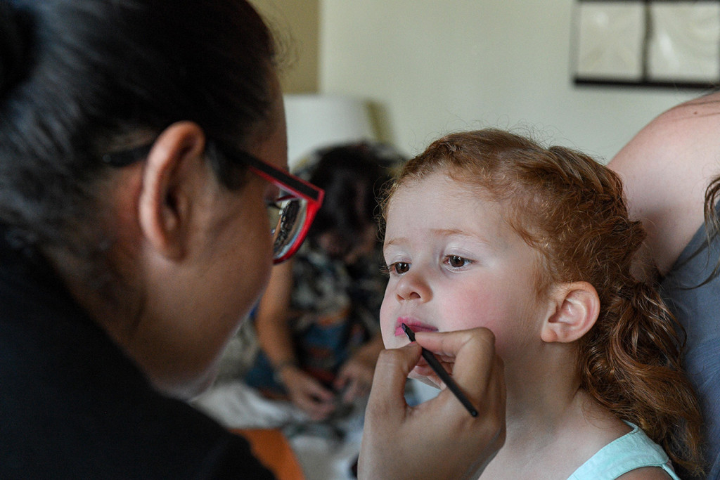 Cute little Flower girl gets her lipstick done at Sofitel Fiji wedding