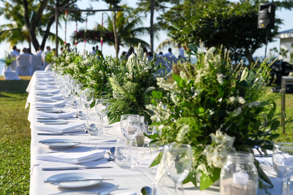 White and green table layout in outdoor Fiji wedding at Sofitel
