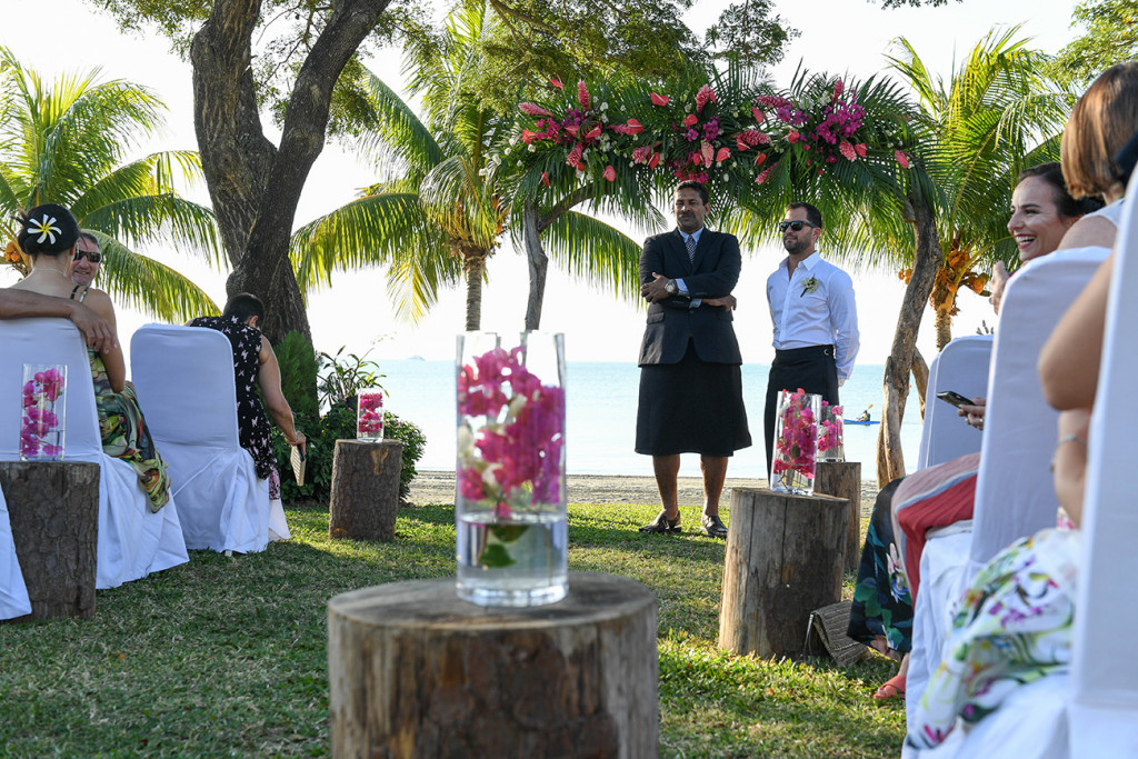 Groom and groomsmen wait at the altar of the outdoor beach wedding in Sofitel Fiji