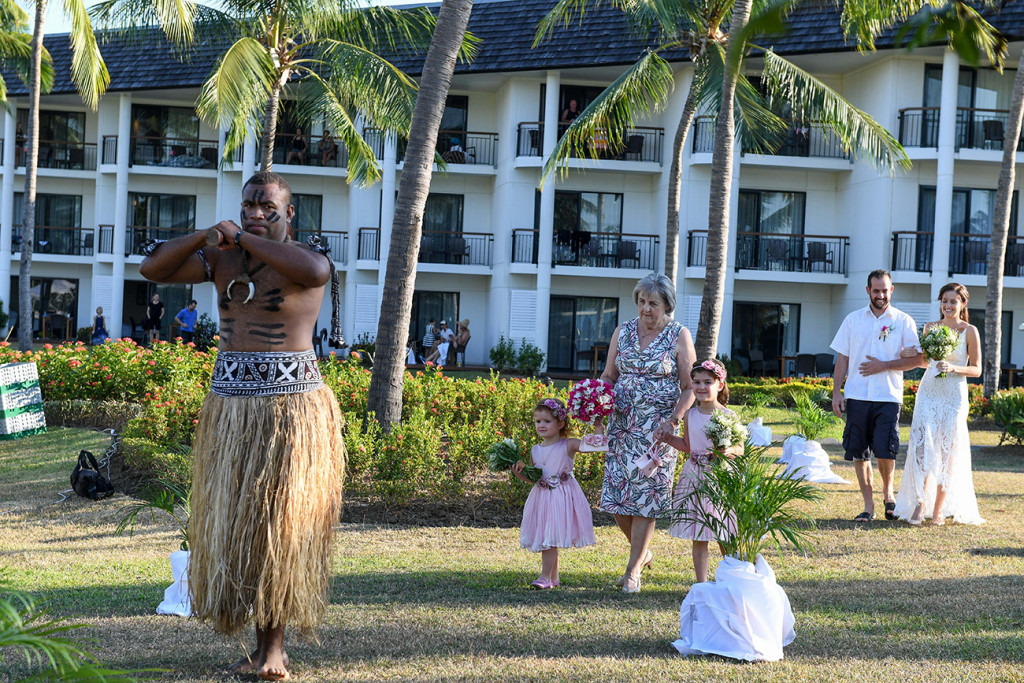 Fiji warrior dances ahead of the bridal party in Fiji Sofitel wedding